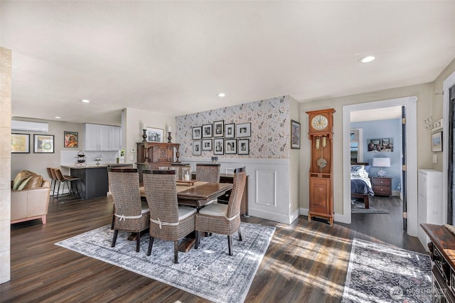 6008 S Bakerview Park Dr, Ferndale, WA 98248 - dining area with a wall unit AC, dark wood-style flooring, wainscoting, and recessed lighting