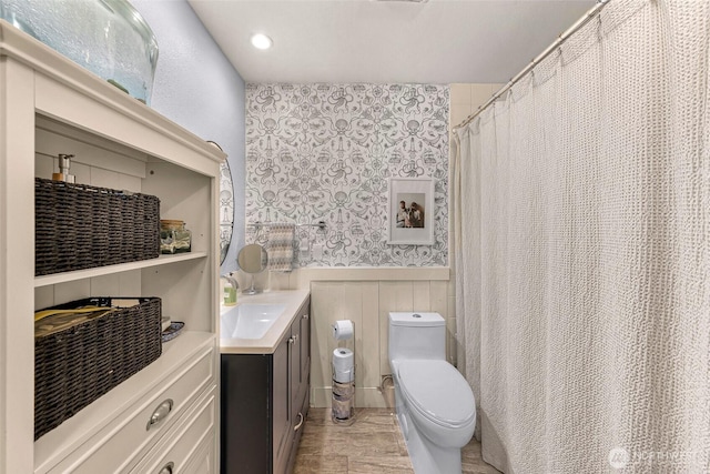 6008 S Bakerview Park Dr, Ferndale, WA 98248 - full bath with vanity, a wainscoted wall, and wallpapered walls