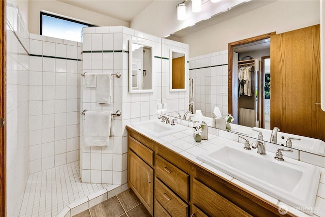 29812 Marine View Dr SW, Federal Way, WA 98023 - full bath featuring double vanity, a walk in shower, tile patterned floors, a spacious closet, and tile walls