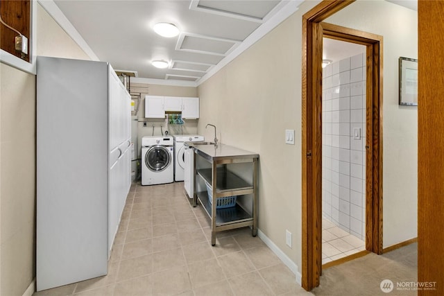 29812 Marine View Dr SW, Federal Way, WA 98023 - laundry area featuring cabinet space, washing machine and dryer, and light tile patterned floors