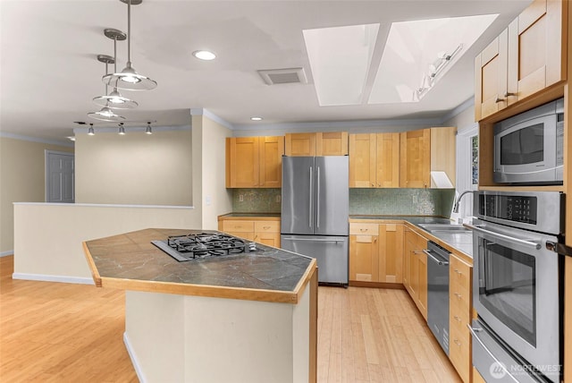 21313 2nd Dr SE, Bothell, WA 98021 - kitchen with stainless steel appliances, rail lighting, ornamental molding, backsplash, and light wood-style flooring