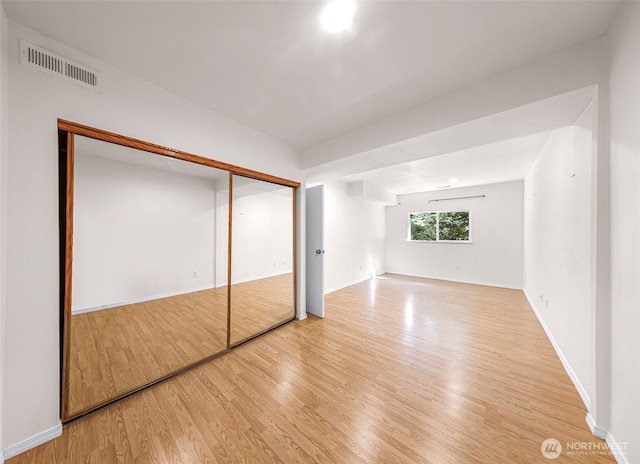 21313 2nd Dr SE, Bothell, WA 98021 - unfurnished bedroom with wood finished floors and a closet