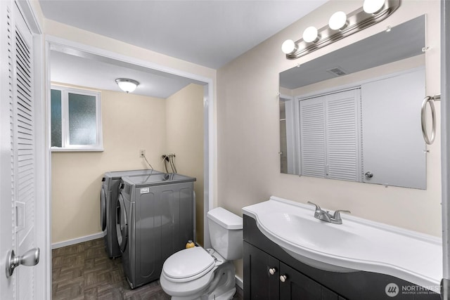 21313 2nd Dr SE, Bothell, WA 98021 - bathroom featuring a closet, washer and dryer, and vanity