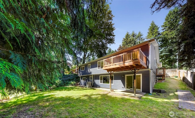 21313 2nd Dr SE, Bothell, WA 98021 - back of house featuring a wooden deck and a fenced backyard