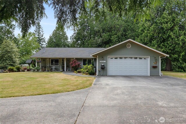 23019 Arlington Heights Rd, Arlington, WA 98223 - ranch-style home featuring a front lawn, an attached garage, concrete driveway, and a porch