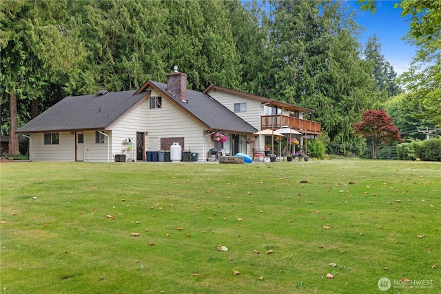23019 Arlington Heights Rd, Arlington, WA 98223 - rear view of house featuring a chimney and a yard