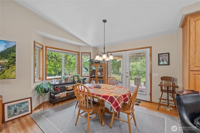 23019 Arlington Heights Rd, Arlington, WA 98223 - dining space with plenty of natural light, vaulted ceiling, a chandelier, and light wood-style floors