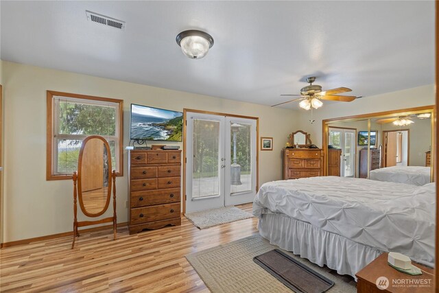 23019 Arlington Heights Rd, Arlington, WA 98223 - bedroom with french doors, access to exterior, and light wood-type flooring