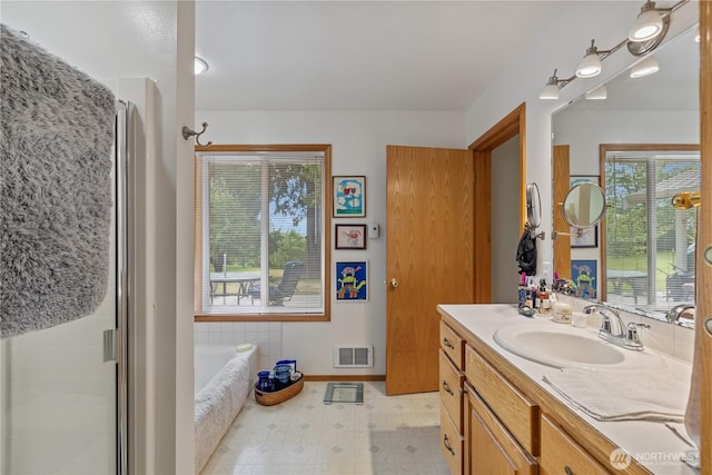 23019 Arlington Heights Rd, Arlington, WA 98223 - full bathroom featuring plenty of natural light, vanity, a garden tub, and a shower stall