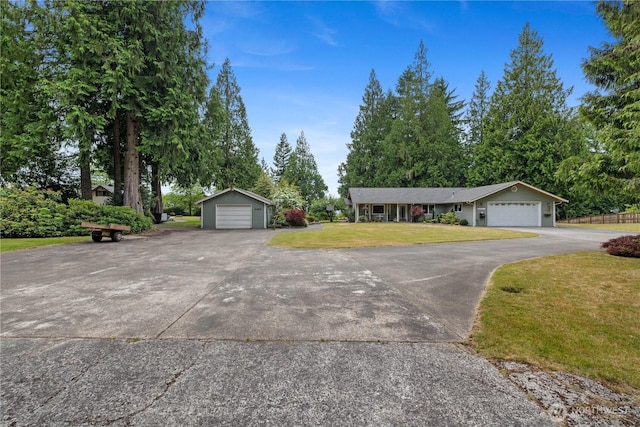 23019 Arlington Heights Rd, Arlington, WA 98223 - ranch-style house with a front yard, a detached garage, and an outdoor structure