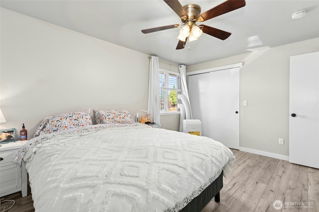 2427 Spruce Rd, Lake Stevens, WA 98258 - bedroom with light wood-style floors, ceiling fan, and a closet