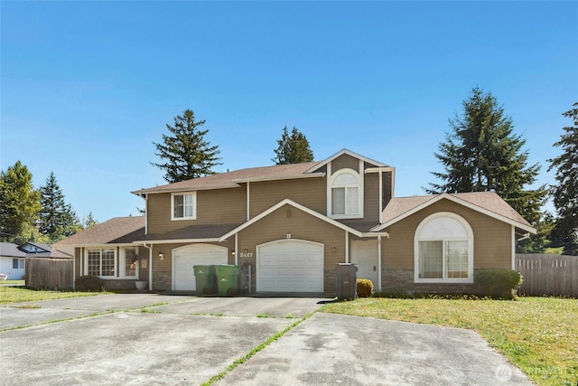2427 Spruce Rd, Lake Stevens, WA 98258 - traditional home with concrete driveway, a garage, and stone siding