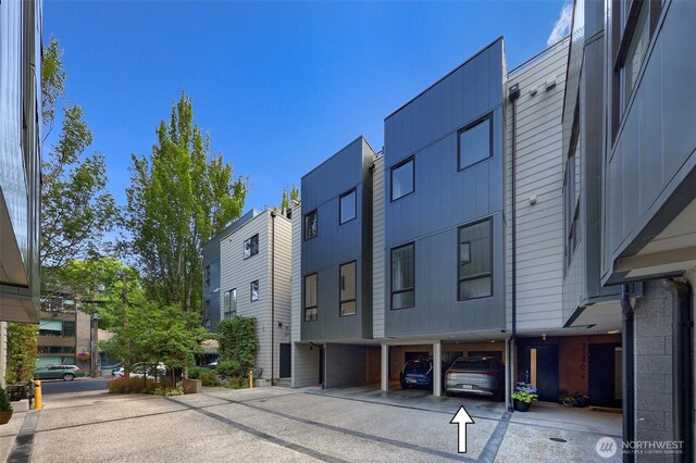 1117 34th Ave Unit B, Seattle, WA 98122 - view of building exterior featuring covered parking and a residential view