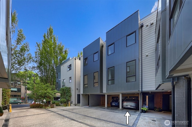 1117 34th Ave Unit B, Seattle, WA 98122 - view of building exterior featuring covered parking and a residential view