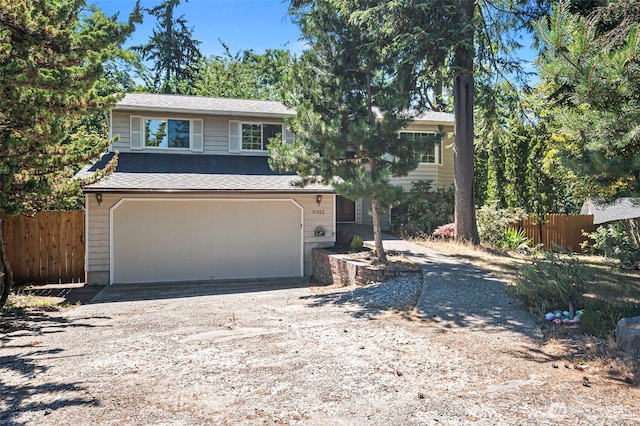 10122 50th Pl W, Mukilteo, WA 98275 - view of front of home featuring an attached garage, driveway, and a shingled roof