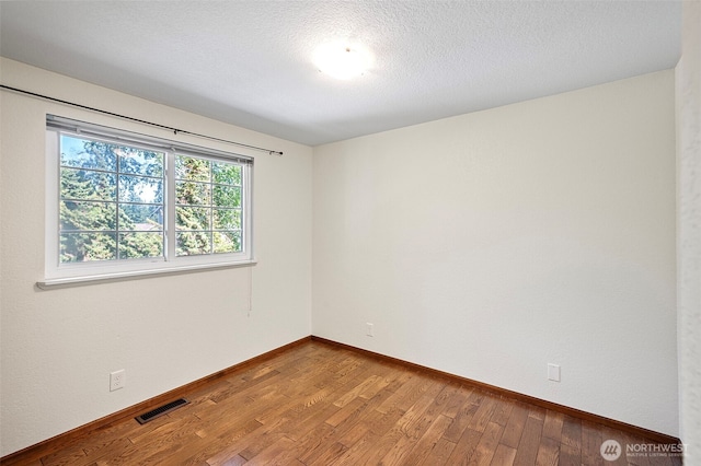 10122 50th Pl W, Mukilteo, WA 98275 - empty room featuring hardwood / wood-style flooring and baseboards