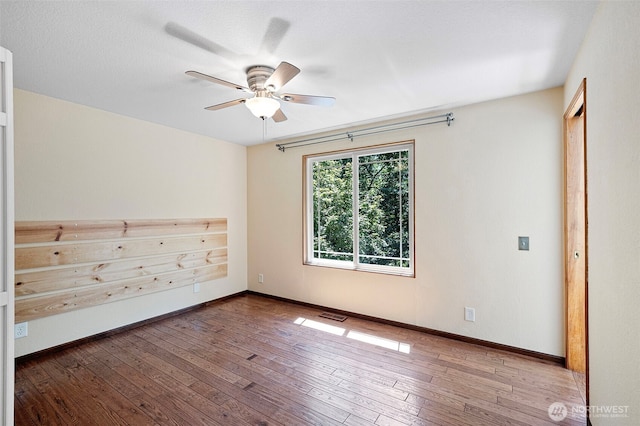 10122 50th Pl W, Mukilteo, WA 98275 - spare room with a ceiling fan and hardwood / wood-style floors