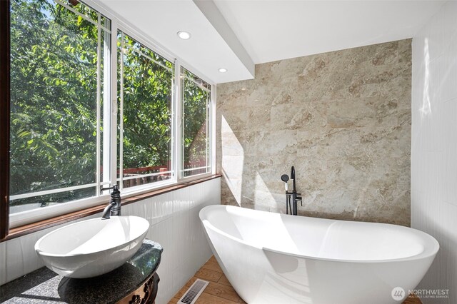 10122 50th Pl W, Mukilteo, WA 98275 - bathroom with tile walls, a soaking tub, and recessed lighting