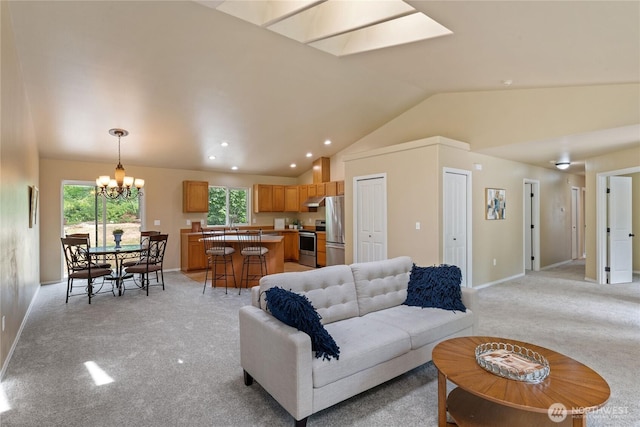 6401 151st St NW, Gig Harbor, WA 98332 - living room featuring lofted ceiling, a chandelier, light colored carpet, recessed lighting, and a skylight