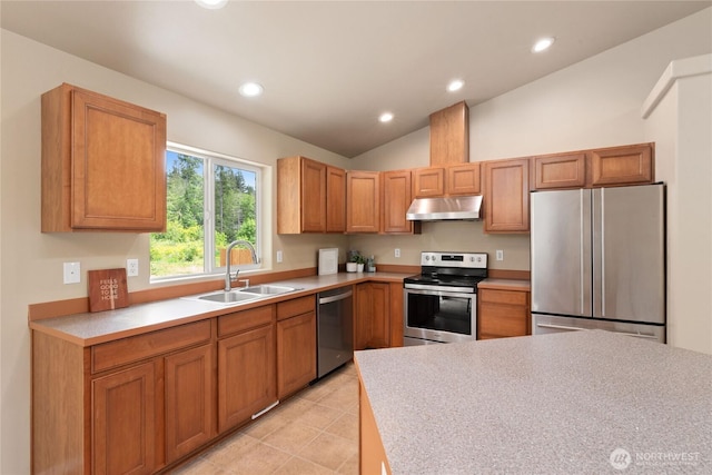 6401 151st St NW, Gig Harbor, WA 98332 - kitchen with stainless steel appliances, under cabinet range hood, light countertops, recessed lighting, and lofted ceiling