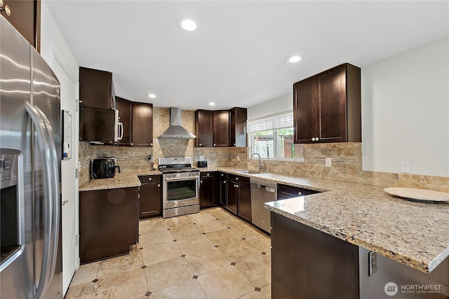 828 Gregory Way SE, Olympia, WA 98513 - kitchen with stainless steel appliances, wall chimney range hood, dark brown cabinetry, light stone countertops, and decorative backsplash