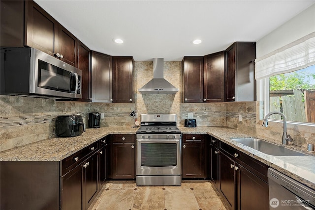 828 Gregory Way SE, Olympia, WA 98513 - kitchen featuring stainless steel appliances, wall chimney range hood, light stone counters, dark brown cabinets, and recessed lighting