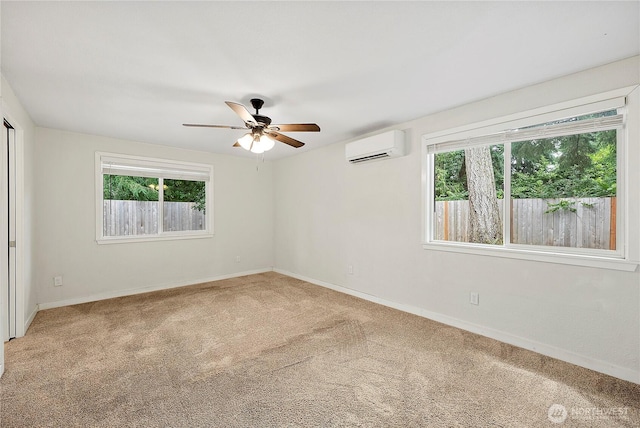 828 Gregory Way SE, Olympia, WA 98513 - carpeted spare room featuring an AC wall unit, healthy amount of natural light, and ceiling fan