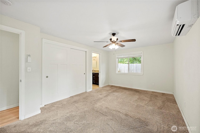 828 Gregory Way SE, Olympia, WA 98513 - unfurnished bedroom with an AC wall unit, light carpet, a closet, and a ceiling fan