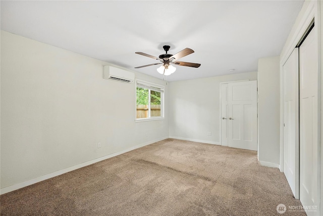 828 Gregory Way SE, Olympia, WA 98513 - unfurnished bedroom with an AC wall unit, carpet, a closet, and a ceiling fan