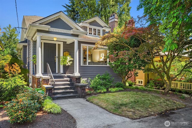 6518 18th Ave NE, Seattle, WA 98115 - view of front of property featuring covered porch and a chimney