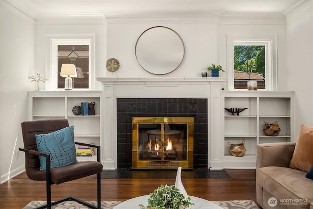 6518 18th Ave NE, Seattle, WA 98115 - sitting room featuring wood finished floors, ornamental molding, and a tiled fireplace