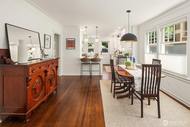 6518 18th Ave NE, Seattle, WA 98115 - dining room featuring dark wood-style flooring, ornamental molding, and recessed lighting