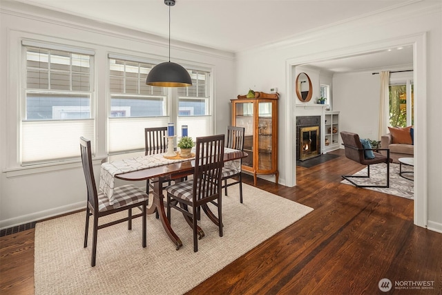 6518 18th Ave NE, Seattle, WA 98115 - dining room with a fireplace with flush hearth, dark wood finished floors, and crown molding