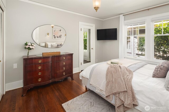 6518 18th Ave NE, Seattle, WA 98115 - bedroom with dark wood-style flooring and crown molding