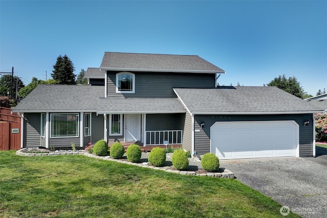 109 77th Pl SW, Everett, WA 98203 - view of front facade with a garage, asphalt driveway, covered porch, a front lawn, and a shingled roof