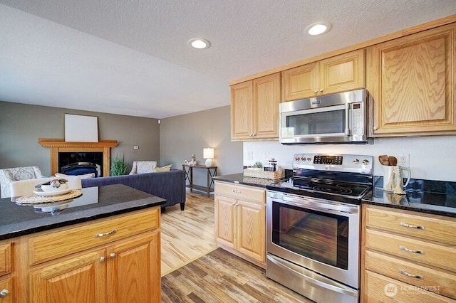 109 77th Pl SW, Everett, WA 98203 - kitchen with stainless steel appliances, light wood-type flooring, open floor plan, recessed lighting, and light brown cabinetry