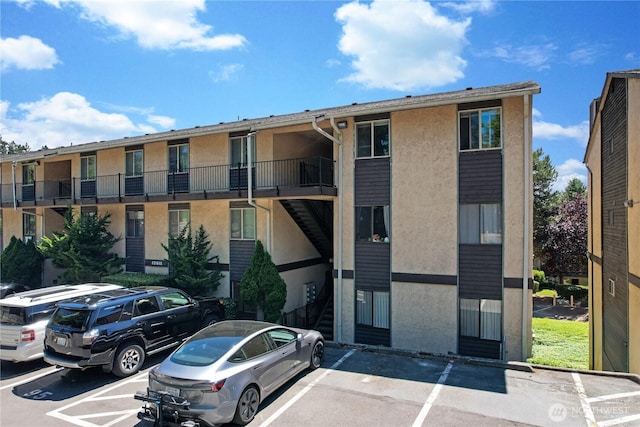 12611 NE 145th Pl Unit H85, Kirkland, WA 98034 - view of apartment building / complex with uncovered parking