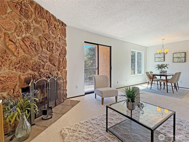 12611 NE 145th Pl Unit H85, Kirkland, WA 98034 - carpeted living room with plenty of natural light, a textured ceiling, and a chandelier