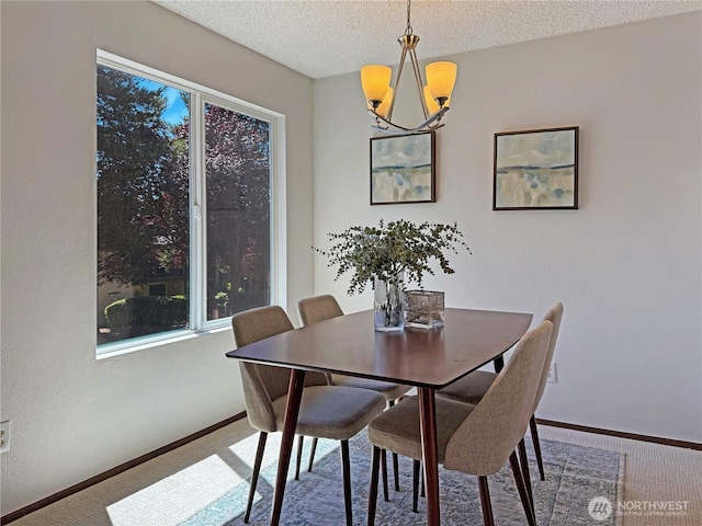 12611 NE 145th Pl Unit H85, Kirkland, WA 98034 - carpeted dining space with a chandelier and a textured ceiling