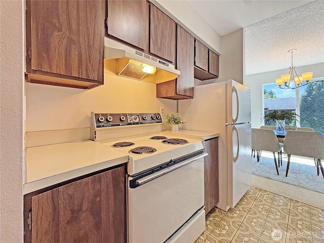 12611 NE 145th Pl Unit H85, Kirkland, WA 98034 - kitchen featuring white range with electric stovetop, range hood, a chandelier, light countertops, and a textured ceiling