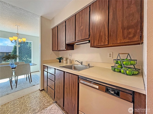 12611 NE 145th Pl Unit H85, Kirkland, WA 98034 - kitchen featuring white dishwasher, a chandelier, light countertops, decorative light fixtures, and a textured ceiling