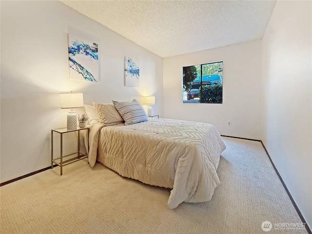 12611 NE 145th Pl Unit H85, Kirkland, WA 98034 - carpeted bedroom featuring a textured ceiling and baseboards