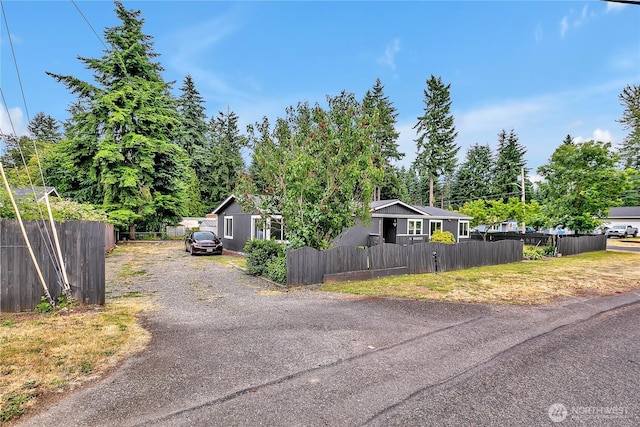 10707 209th Ave E, Bonney Lake, WA 98391 - view of front of home with a fenced front yard and driveway