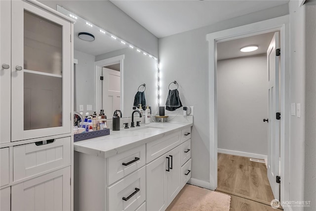 10707 209th Ave E, Bonney Lake, WA 98391 - bathroom with vanity and wood finished floors