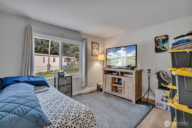 10707 209th Ave E, Bonney Lake, WA 98391 - bedroom with baseboards and wood finished floors