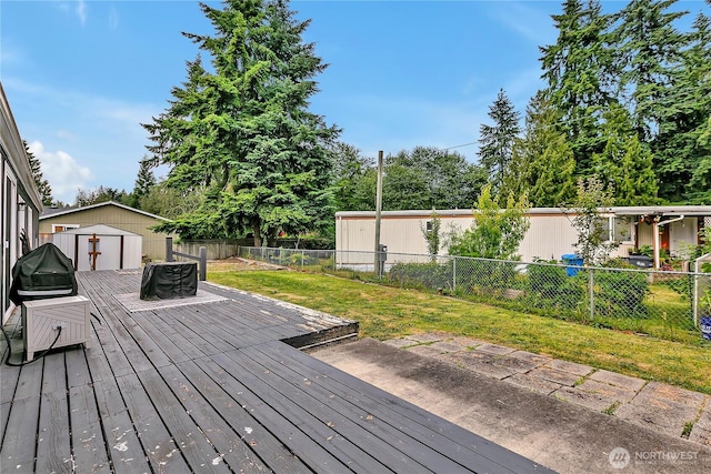 10707 209th Ave E, Bonney Lake, WA 98391 - wooden terrace featuring a storage shed and a fenced backyard