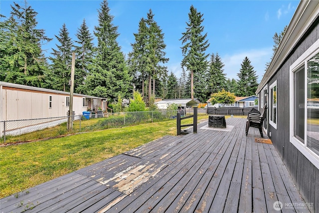 10707 209th Ave E, Bonney Lake, WA 98391 - wooden terrace with a fenced backyard and view of wooded area
