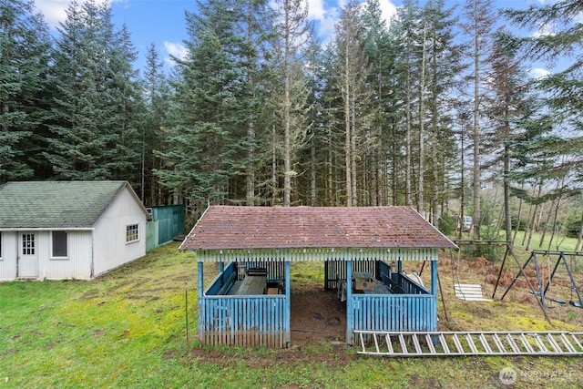 1869 Van Hoesen Rd, Onalaska, WA 98570 - view of grassy yard featuring an outbuilding and a forest view
