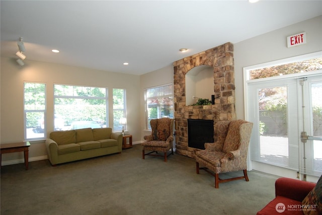 12712 Admiralty Way Unit B202, Everett, WA 98204 - living area with healthy amount of natural light, a stone fireplace, carpet floors, and recessed lighting