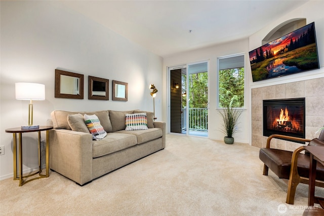 12712 Admiralty Way Unit B202, Everett, WA 98204 - living room featuring carpet floors and a tile fireplace